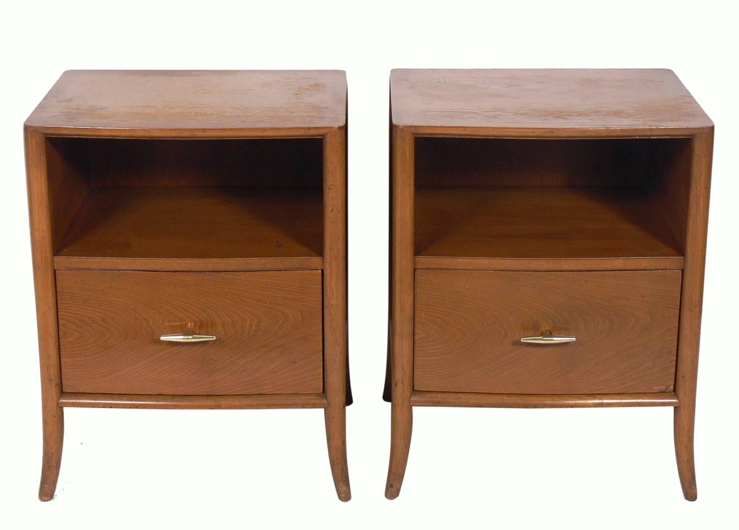 Pair of walnut and brass nightstands or end tables, designed by T.H. Robsjohn-Gibbings for Widdicomb, circa 1950s. They are a versatile size and can be used as nightstands, or as end or side tables. They are currently being refinished and can be