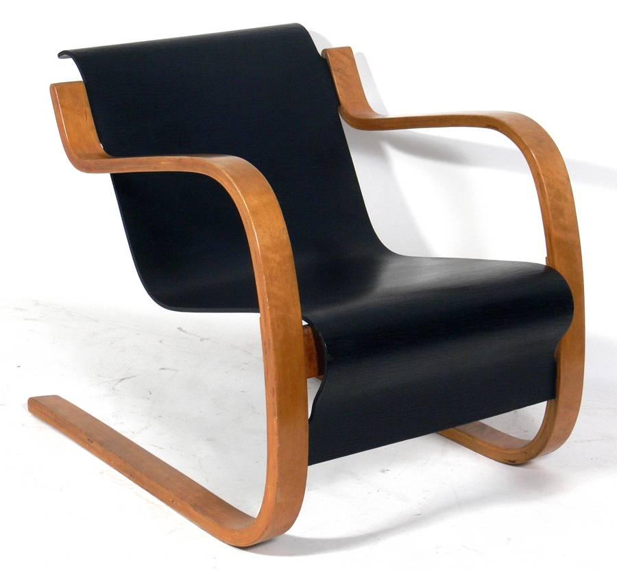 Cantilever lounge chair model 31/42 by Alvar Aalto for Artek, Finland. This example is believed to be circa 1940s. It retains a warm patina to the wood.