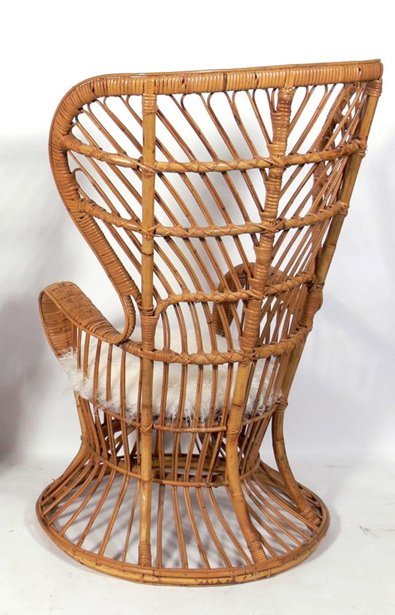 Tall back rattan lounge chair, Italian, circa 1950s. It retains its warm original patina. Designed for the Italian cruise ship Conte Biancamano, with interiors and furnishings designed by Gio Ponti and Aurelio Caminati, and manufactured by