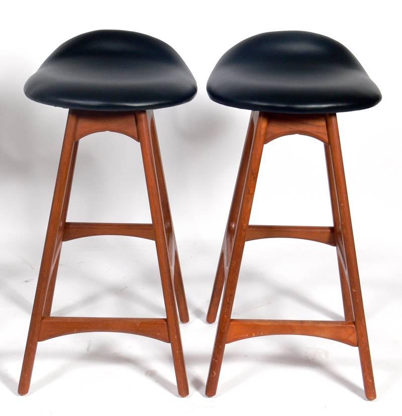 Danish modern teak bar stools by Erik Buck. They measure 27.5