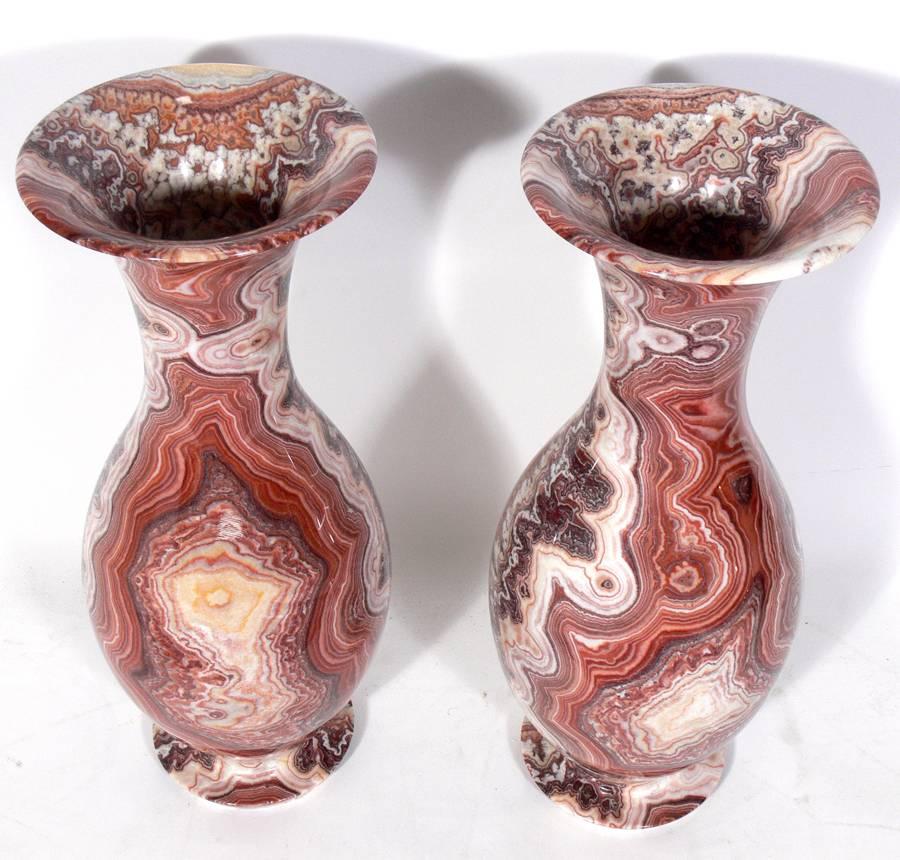 Pair of large-scale Agate urns, 20th century. Beautiful specimens in deep oxblood reds, deep browns, and whites. These are the largest pair of agate urn vases we have seen in our twenty years in the antique business.