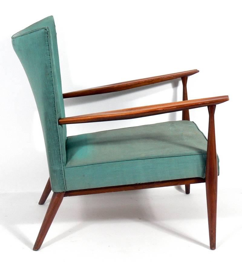 Modernist lounge chair, designed by Paul McCobb, circa 1950s. This chair has wonderful lines at every turn, and looks great from any angle. Very comfortable. This piece is currently being reupholstered. The price noted includes reupholstery in your