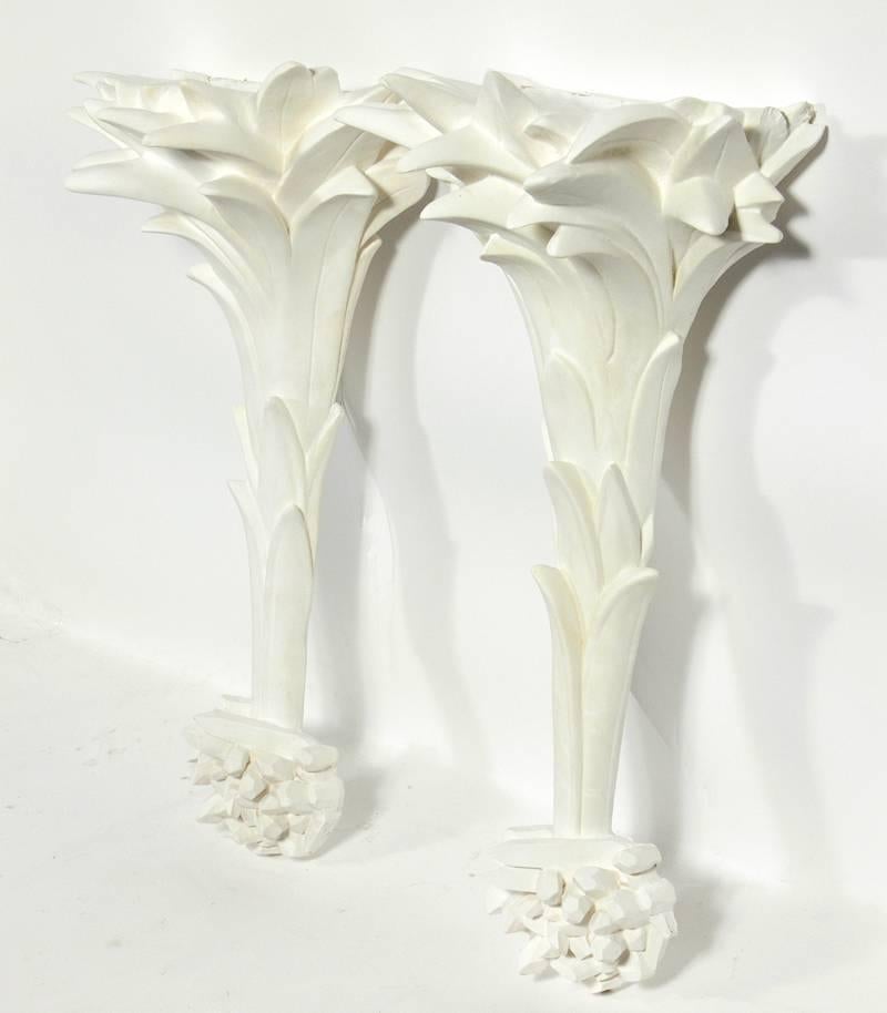 Pair of white plaster sconces, in the manner of Serge Roche, probably American, believed to be circa 1960s. They have been rewired and are ready to use.