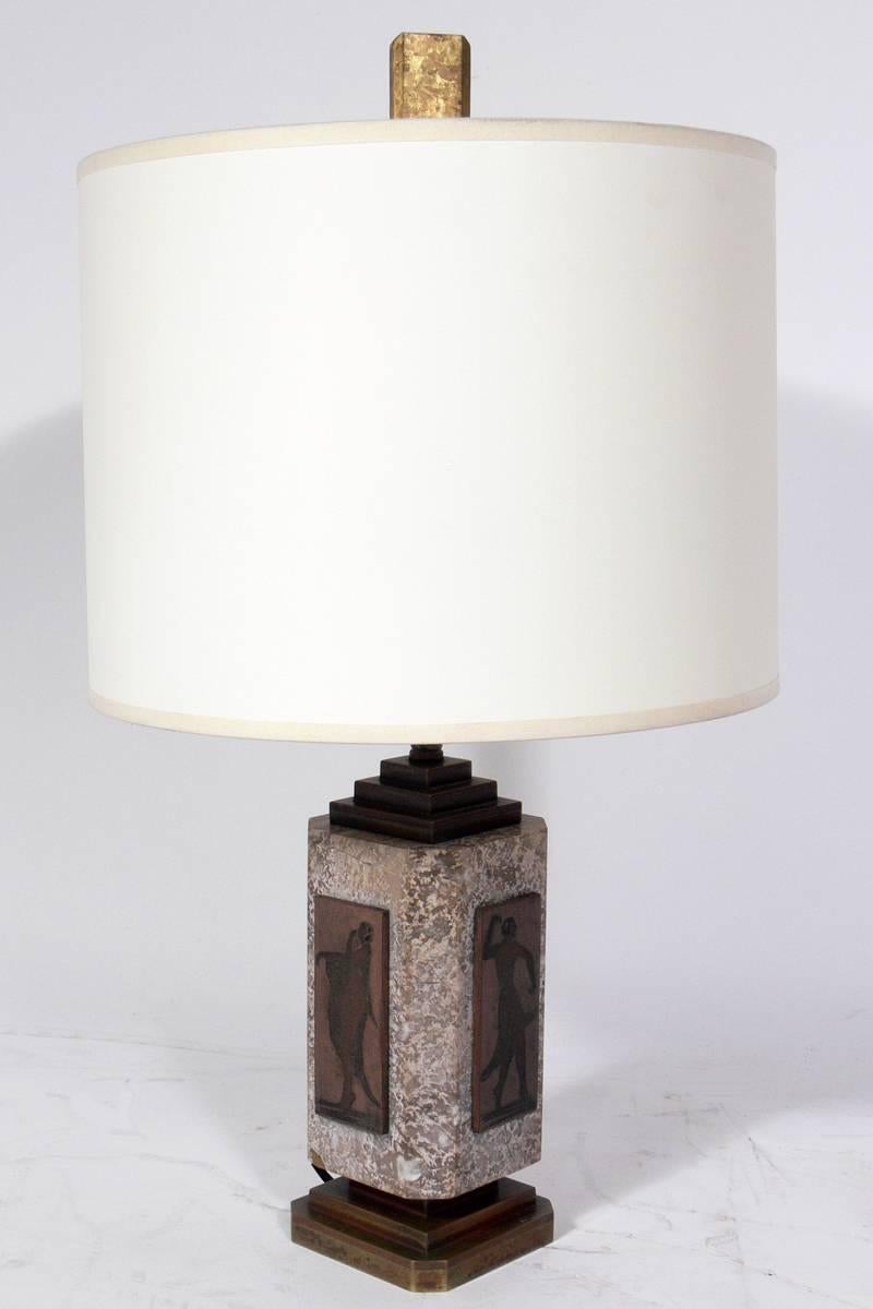 French Art Deco marble and bronze lamp by A. Desgranges, France, circa 1930s. Desgranges was best known for dinandarie, which is the manner that the bronze panels of this lamp are decorated. It has been rewired and is ready to use.