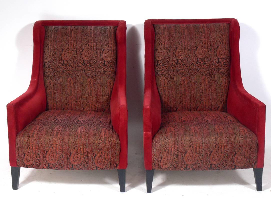 Pair of modern wing back lounge chairs by Andrew Martin, England, circa 2000s. These chairs are the 