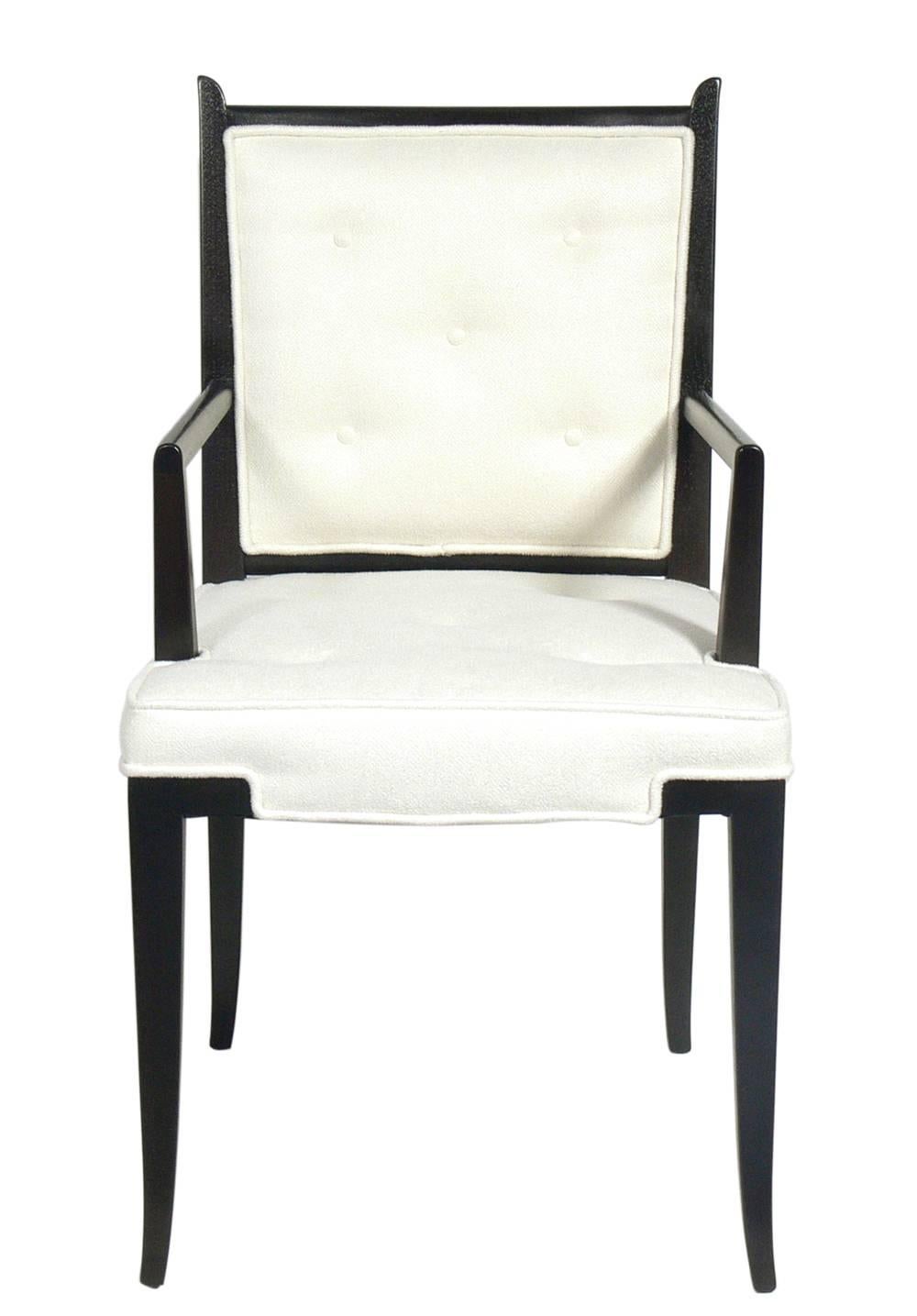 Pair of Tommi Parzinger chairs, American, circa 1950s. They are a versatile size and can be used as lounge or occasional chairs in a living area or bedroom, or as dining or game table chairs. They have been completely restored in an ivory color