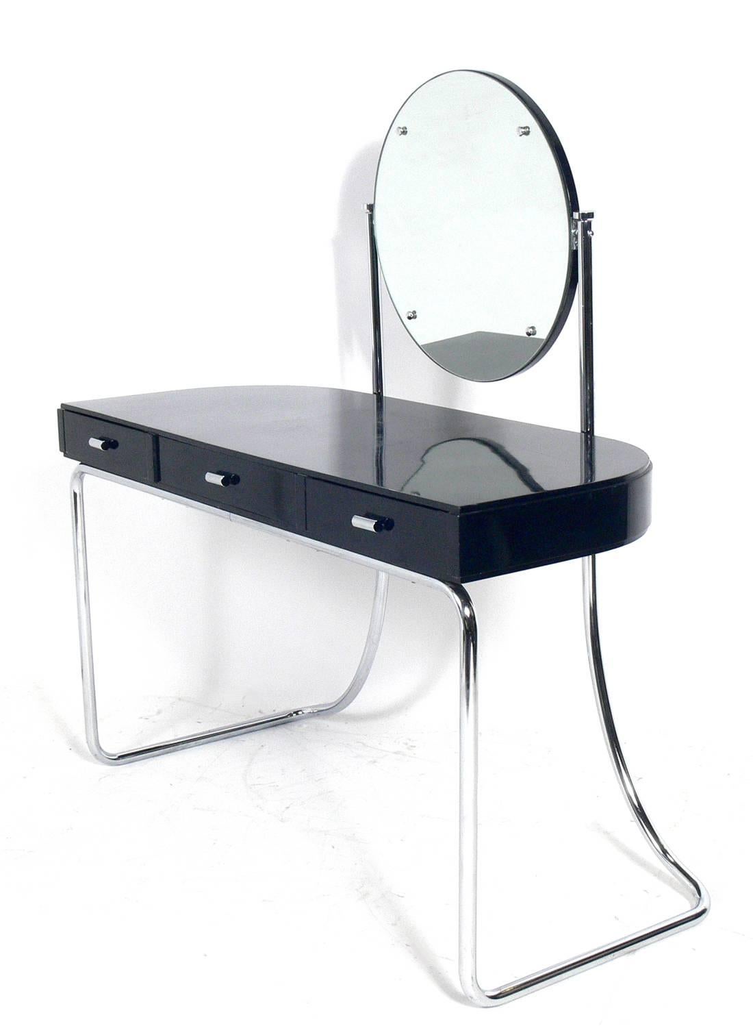 Art Deco black and chrome vanity attributed to Marcel Breuer for Venesta Sumnot, circa 1930s. Makers mark underneath. See detail photo. It retains the original black lacquer finish. The vanity stool measures 18