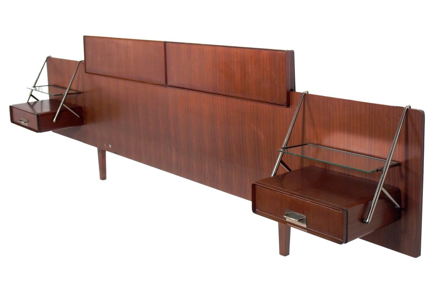 Modernist rosewood headboard with floating nightstands, designed by Silvio Cavatorta, Italian, circa 1950s. This will work with most standard bed frames.