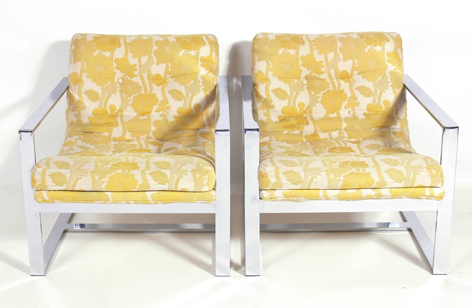 Milo Baughman chrome lounge chairs, American, circa 1960s. They retain the Milo Baughman for Thayer Coggin tag under the seat. Clean lined, architectural chrome frames are a great contrast to the curvaceous seats. These chairs are currently being