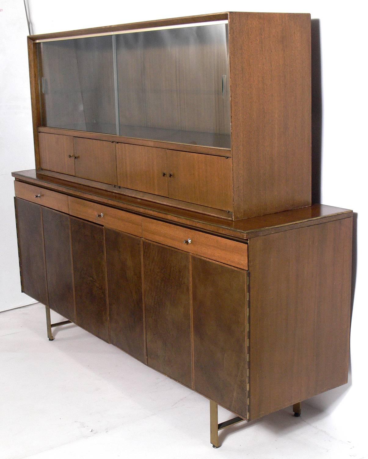 Modern leather front credenza by Paul McCobb for Calvin, American, circa 1950s. This piece is currently being refinished and can be completed in your choice of color. The price noted below includes refinishing in your choice of color. This piece