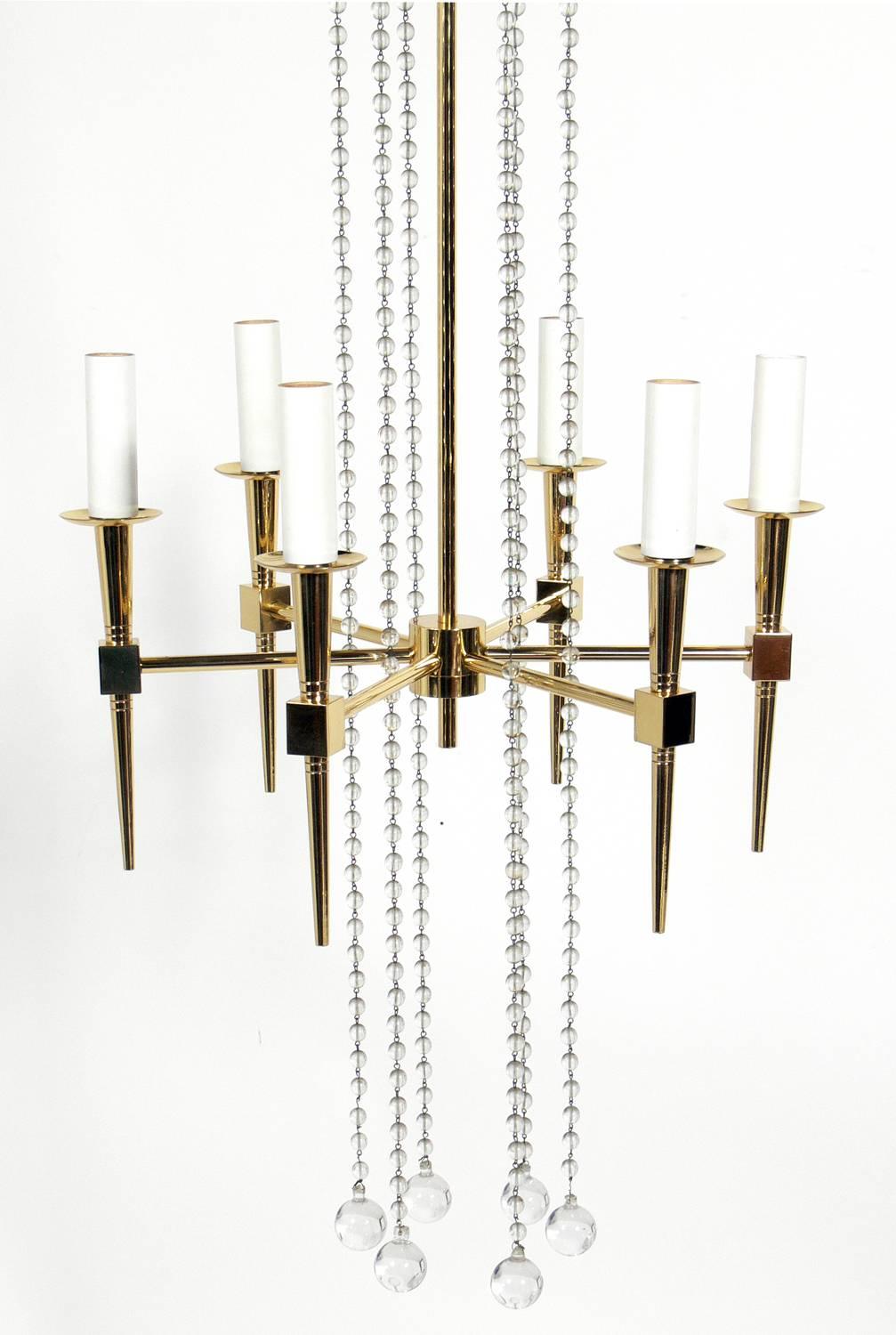 Brass and crystal chandelier by Tommi Parzinger.