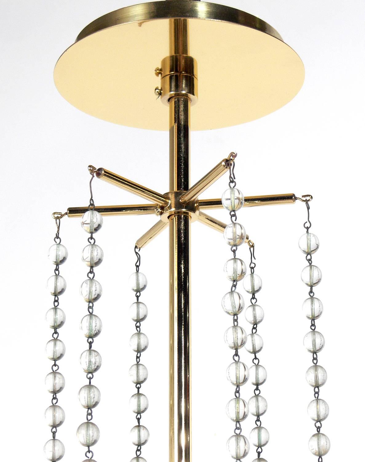 Mid-Century Modern Brass and Crystal Chandelier by Tommi Parzinger 