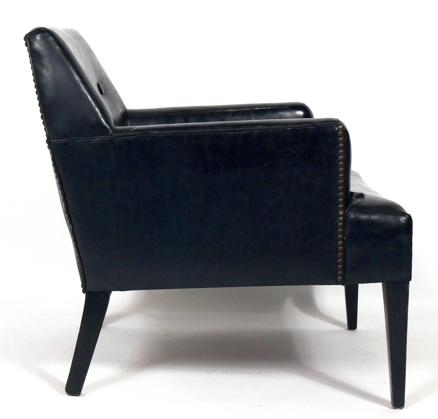 Angular Mid-Century Modern lounge chair, in the manner of Dunbar, American, circa 1950s. This chair is currently being reupholstered and refinished. It can be completed in your choice of finish color and in your fabric. The price noted below