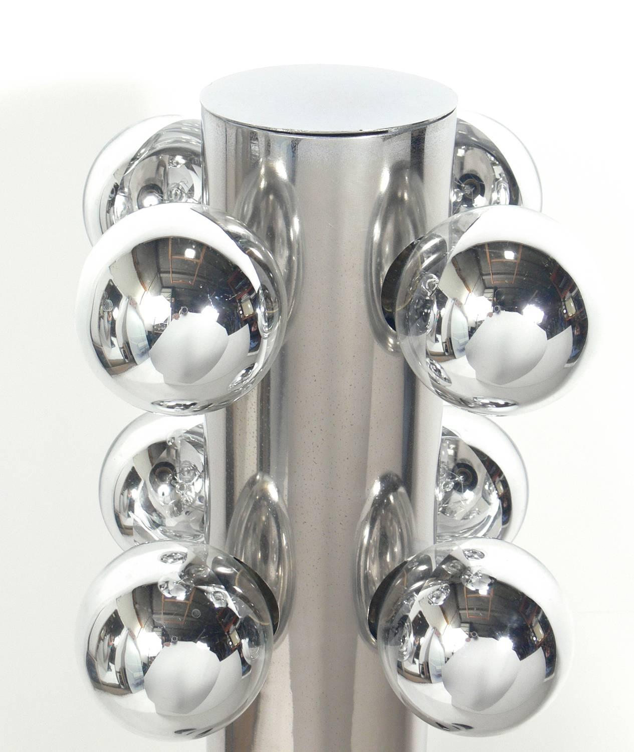 Sleek chrome floor lamp with mirrored bulbs, probably American, circa 1960s. It has been polished and rewired.