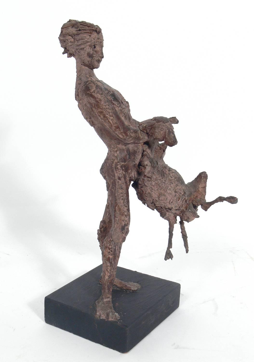 Italian Modernist sculpture of playful nude boy with lamb, artist unknown, Italy, circa 1950s. Constructed of clay or resin on original painted wood base.