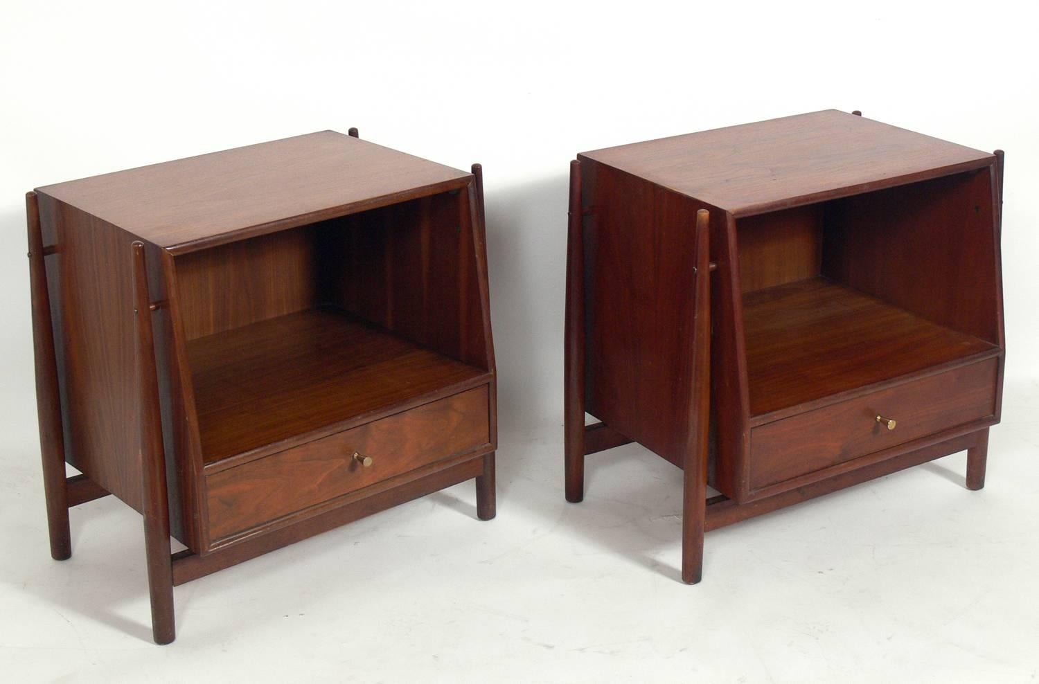 Pair of modern walnut nightstands, designed by Kipp Stewart for Drexel, circa 1960s. They are a versatile size and can be used as nightstands or as end or side tables. They are currently being refinished and can be refinished in your choice of