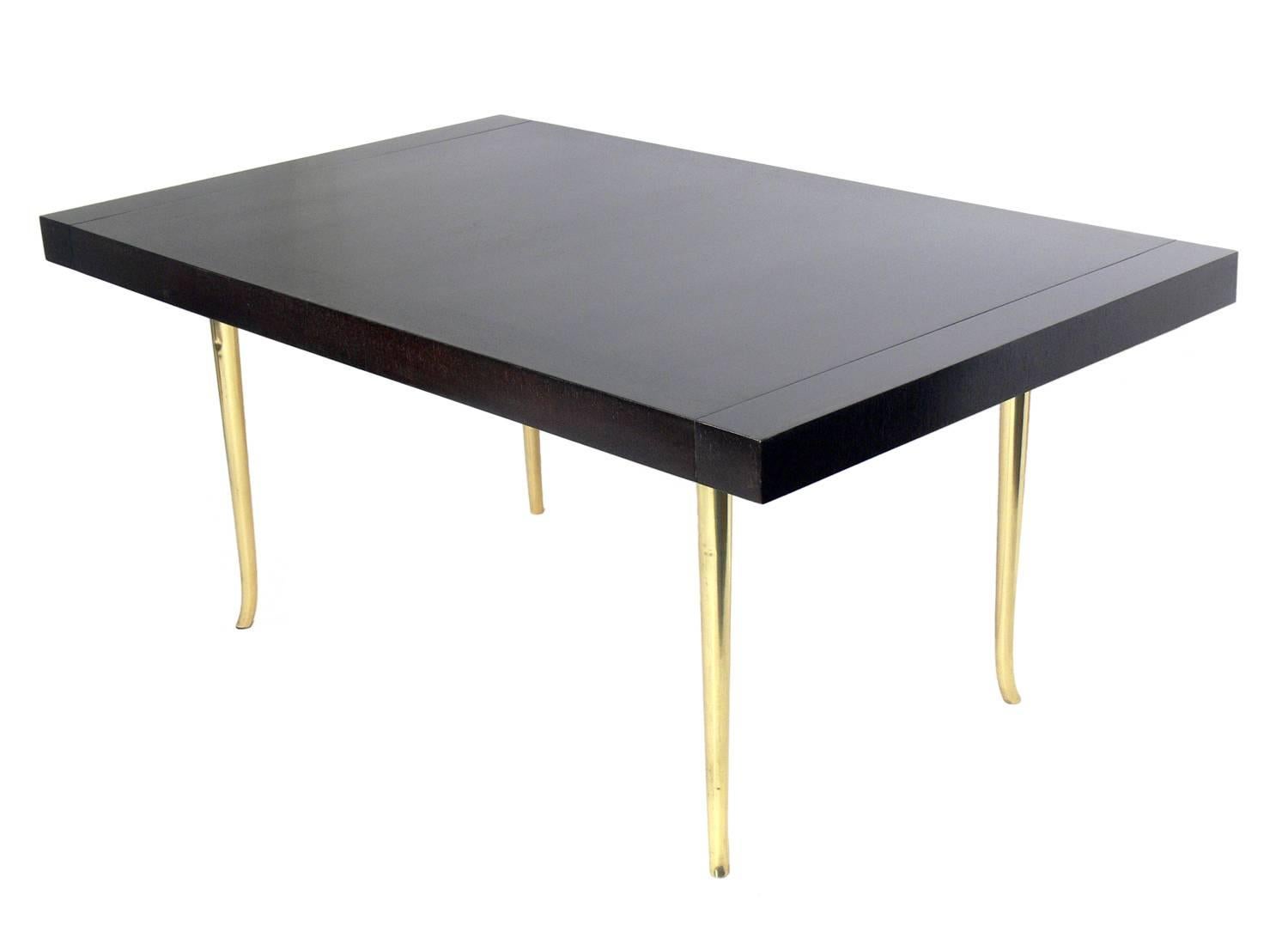 Brass Klismos leg dining table, designed by T.H. Robsjohn-Gibbings for Widdicomb, American, circa 1960s. Recently refinished in an ultra-deep brown color, brass legs polished and lacquered. With both leaves installed the table measures an impressive