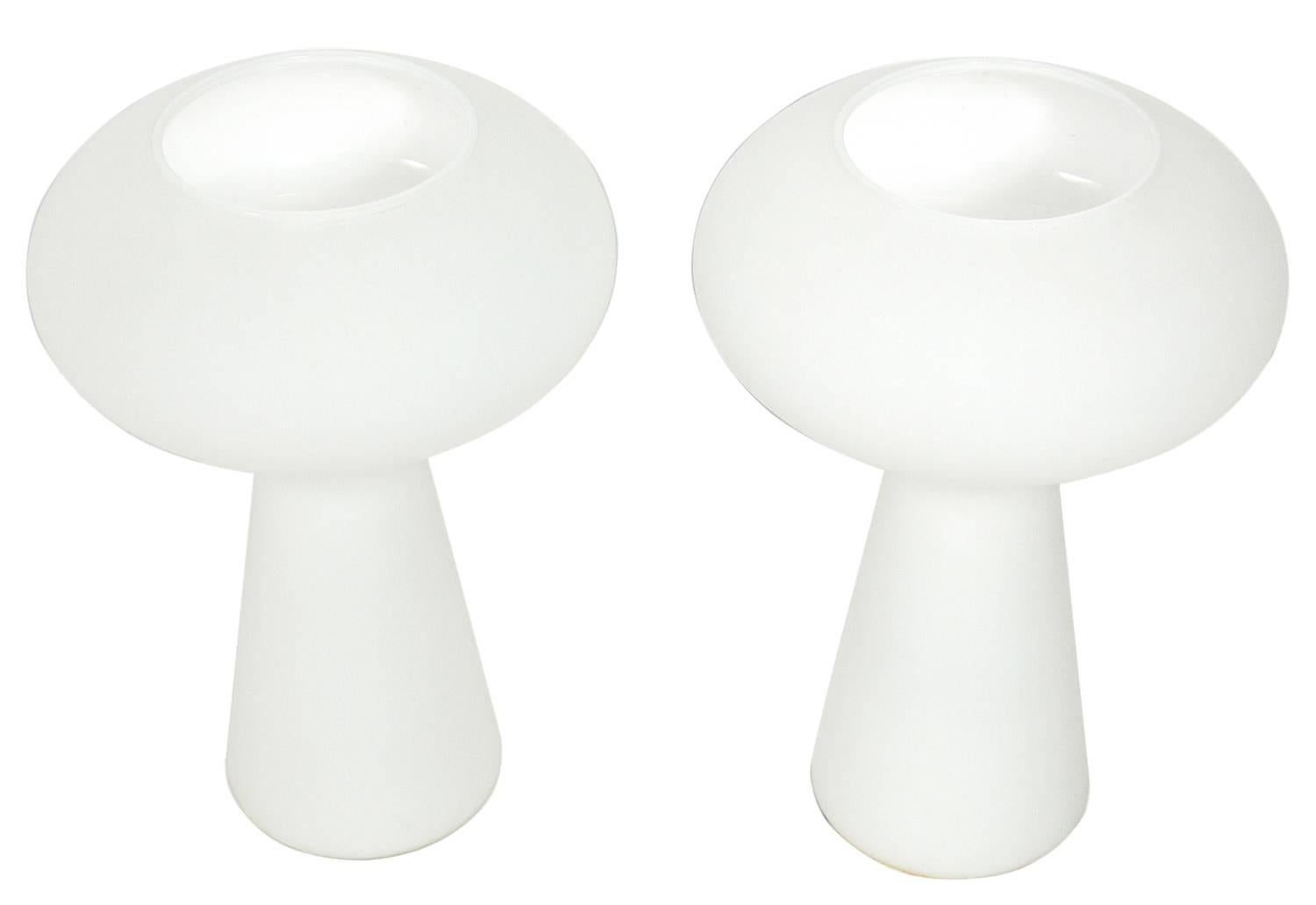Pair of sculptural white glass lamps by Lisa Johansson-Pape, Sweden, circa 1960s. They emit a warm glow when lit. The price noted below is for the pair of lamps.