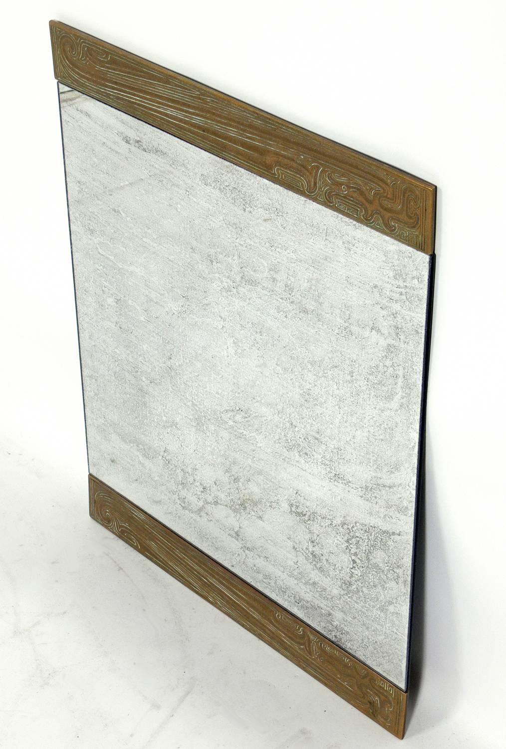 Petite bronze mirror, fashioned from a desk blotter made by Tiffany Studios, American, circa 1910s. Perfect small size mirror for a small powder room or hallway.