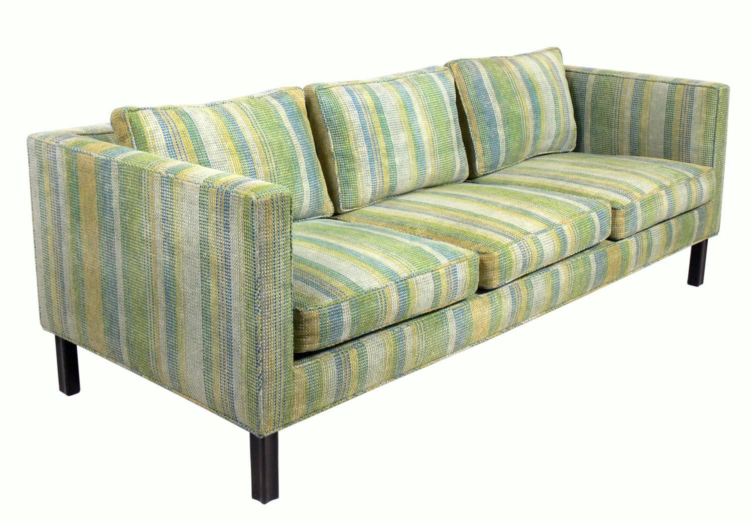 Clean lined sofa, designed by Edward Wormley for Dunbar, American, circa 1960s. It currently retains the original Dunbar upholstery, which is in basically clean usable condition. If you would prefer it reupholstered, we can reupholster it in your