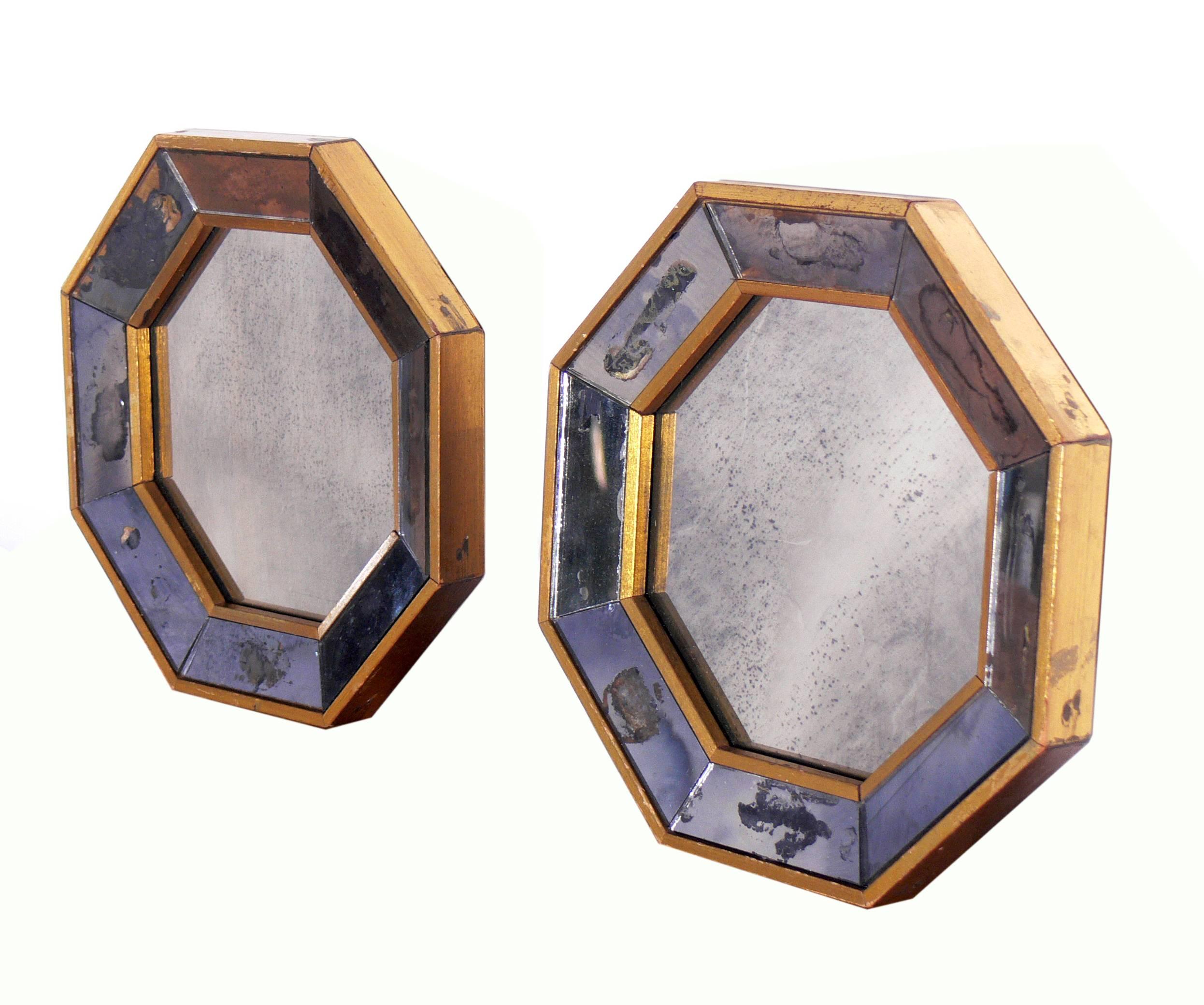 Pair of petite antiqued octagonal mirro, American, circa 1940s. Constructed of gold painted wood frames with antiqued mirrors.