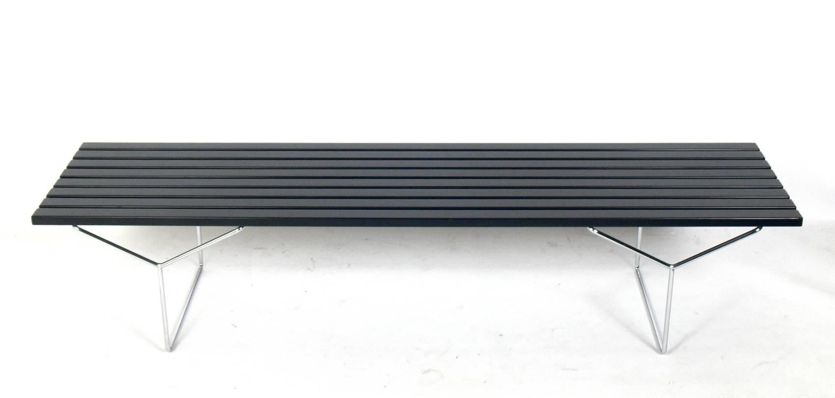 Slat bench or coffee table, designed by Harry Bertoia for Knoll, American, circa 1970s. The wood slats are currently being refinished and can be completed in your choice of color. The chrome legs have been hand polished.
