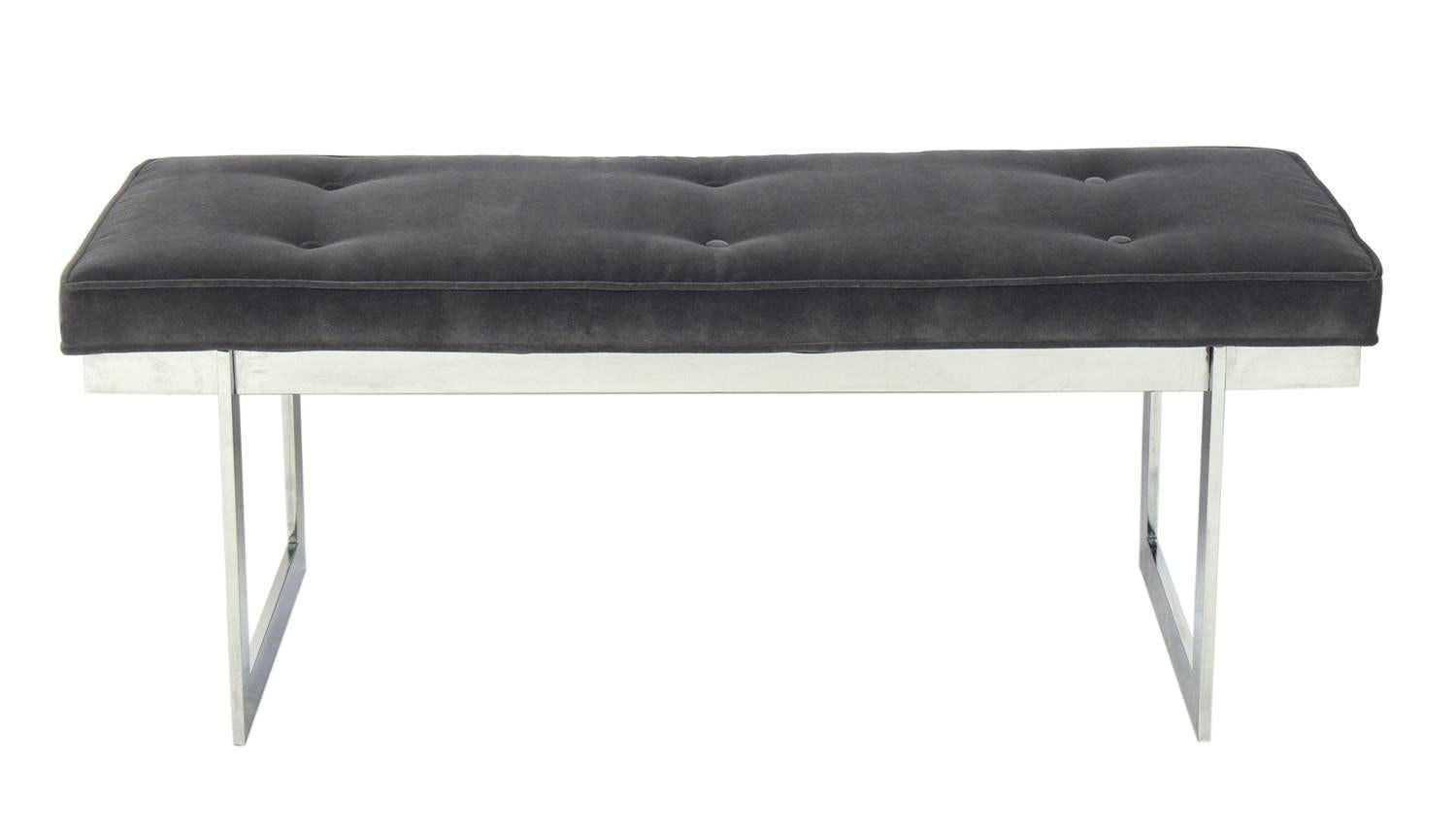 Clean Lined Chrome Bench in the manner of Milo Baughman, American, circa 1960s. It has been reupholstered in a charcoal grey velvety fabric.