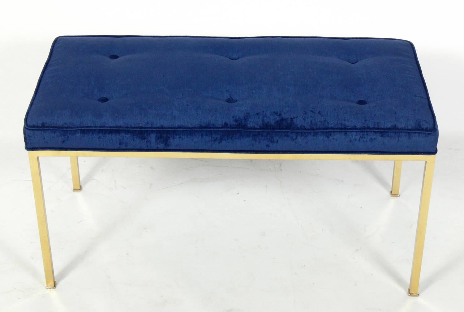 Clean lined brass bench in the manner of Edward Wormley for Dunbar, American, circa 1960s. It has been reupholstered in an indigo blue color velvety fabric.