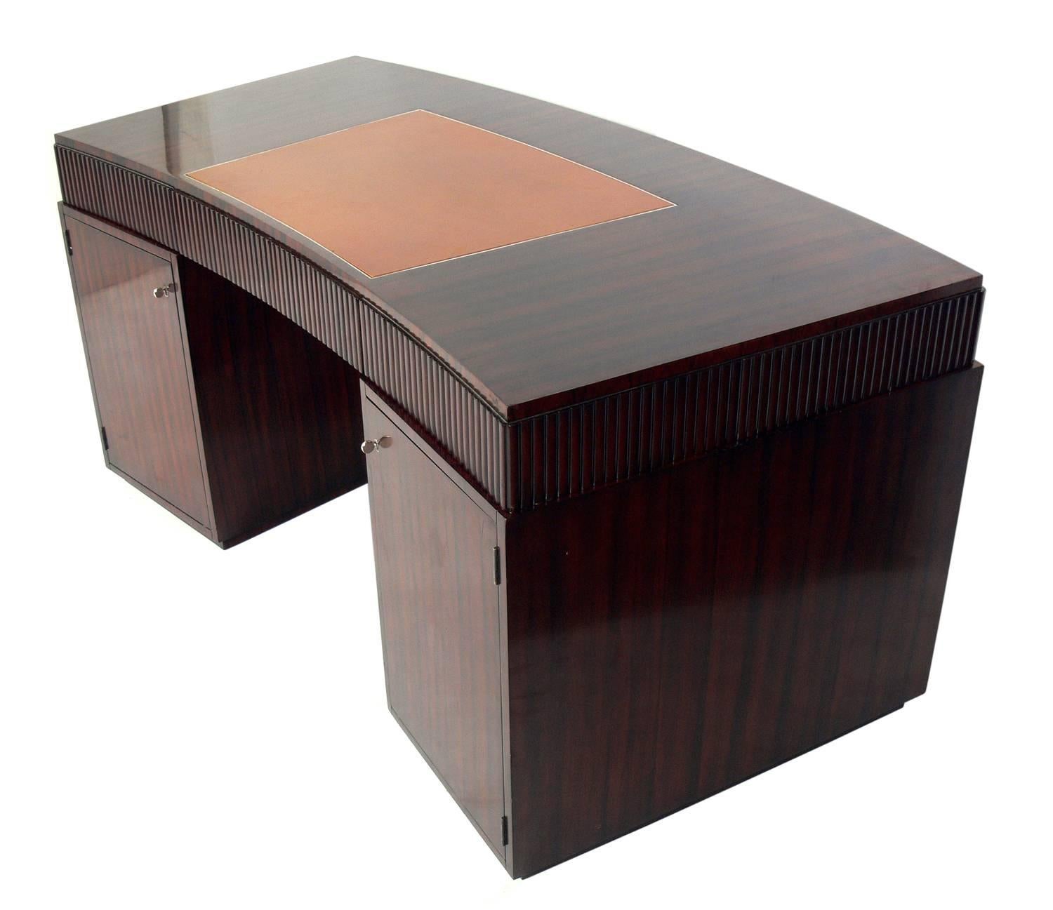 French Art Deco style rosewood desk by Ralph Lauren, American, circa 2000s. Beautifully grained rosewood with an inset leather writing surface. Finished on both sides, so it could be floated in a room.