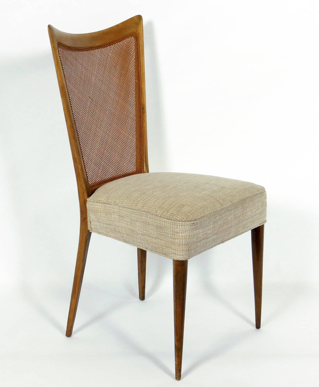 Set of four Italian modern cane back dining chairs, designed by Melchiorre Bega, Italian, circa 1950s. These chairs are currently being refinished and reupholstered. The price noted below includes refinishing in your choice of color and reupholstery
