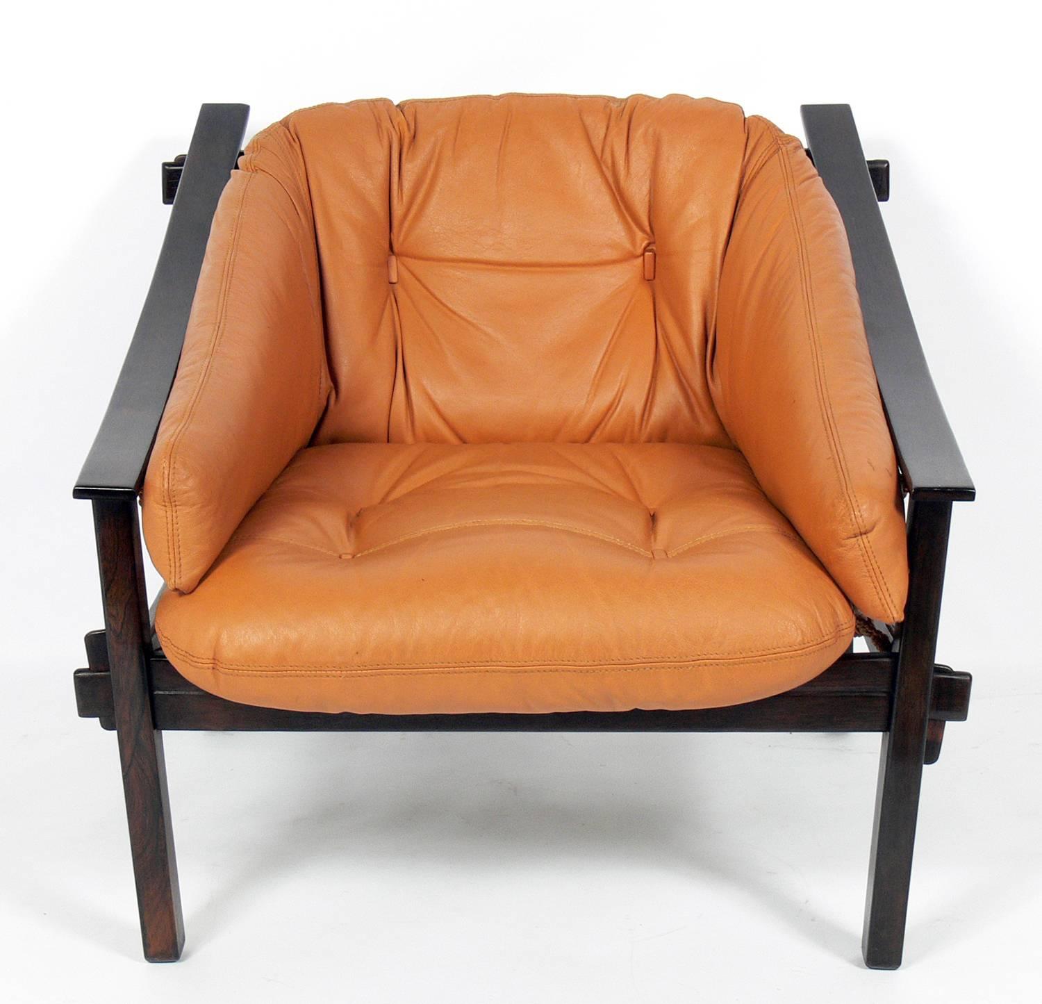 Exotic Jacaranda and leather Brazilian lounge chair, designed by Jean Gillon for Italma Wood Art, Brazil, circa 1960s. It retains its original leather upholstery, which is perfectly worn and broken in if you like aged leather. If you prefer, we can