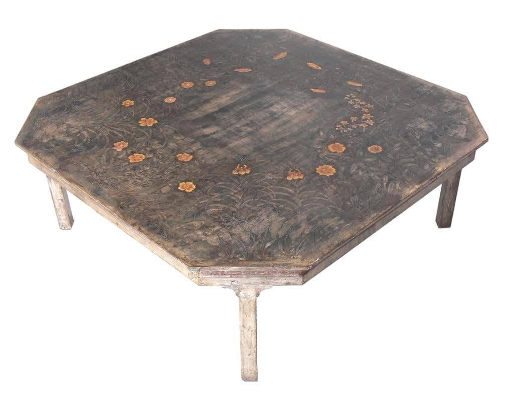 Elegant silver leaf coffee table with hand-carved decoration by artist Max Kuehne, American, circa 1940s. This is a unique piece and it is executed in silver leaf and polychrome on gessoed and carved wood, carved signature by the artist on the edge