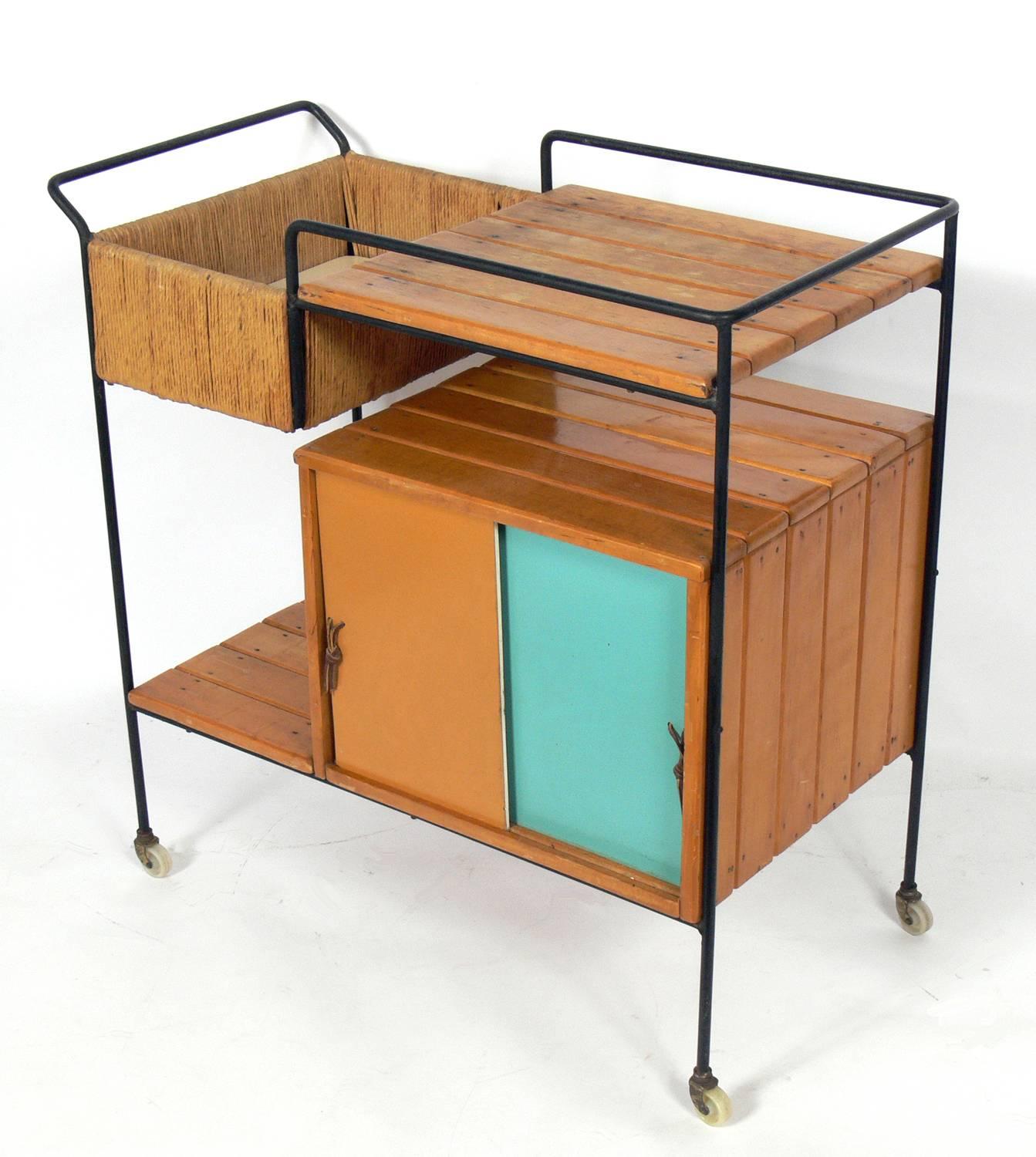 Colorful bar cart by Arthur Umanoff, American, circa 1950s. The top will be refinished and this refinishing of the top is included in the price noted below.