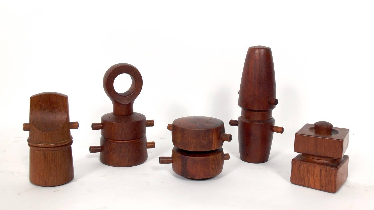 Collection of 20 sculptural Danish modern pepper mills, mostly designed by Jens Quistgaard for Dansk, Danish, circa 1960s. The largest measures 9.25