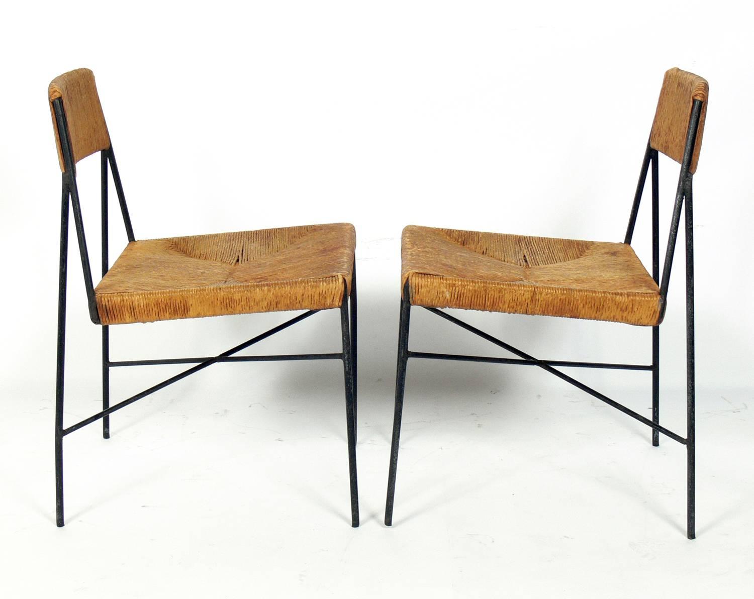 Pair of rare low slung lounge chairs, designed by Arthur Umanoff for Shaver Howard, American, circa 1950s. They retain their warm original patina.