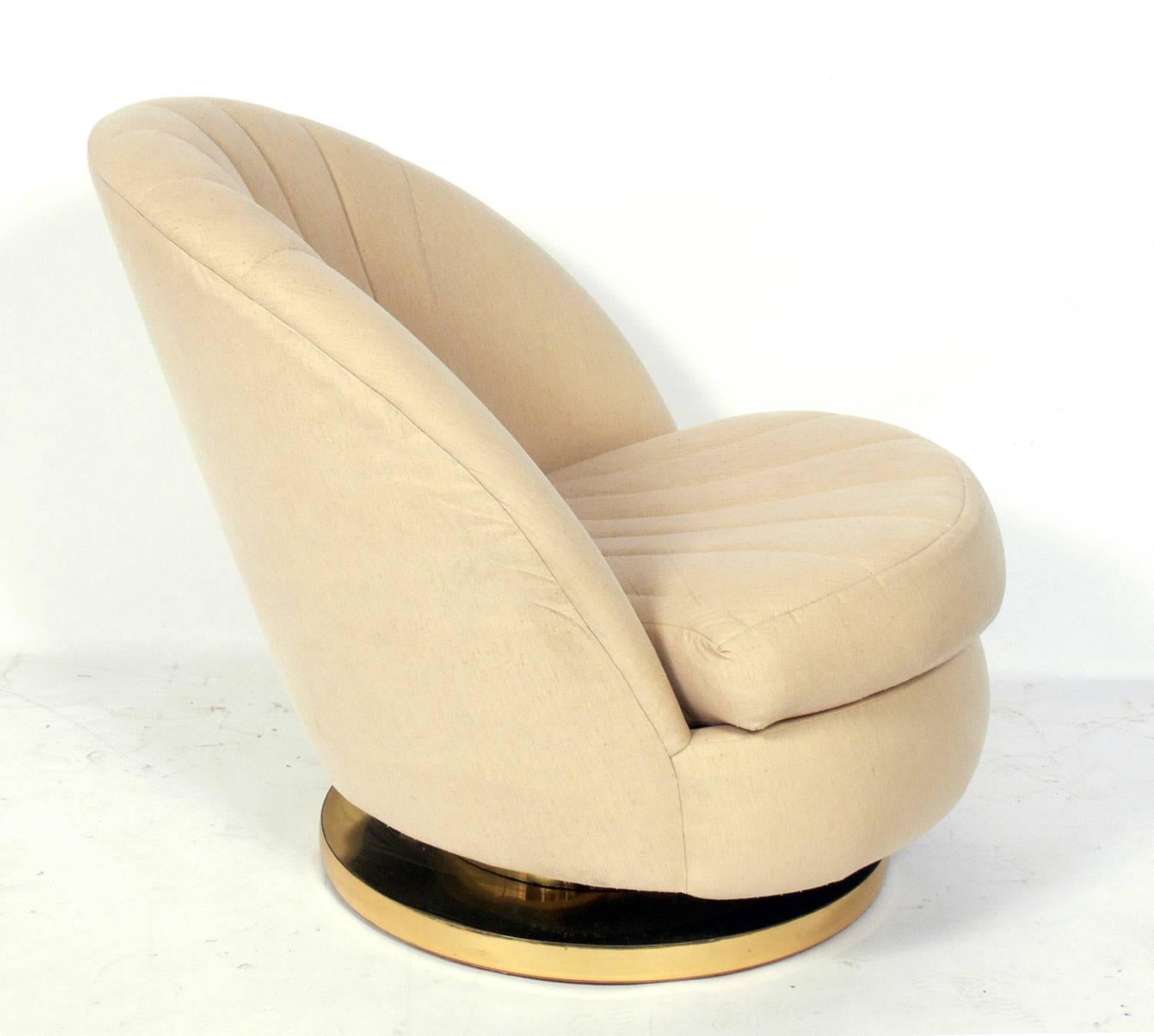 Pair of modern swivel lounge chairs, designed by Milo Baughman for Thayer Coggin, circa 1980s. These chairs are currently being reupholstered and can be completed in your fabric. The price noted below Includes reupholstery in your fabric.