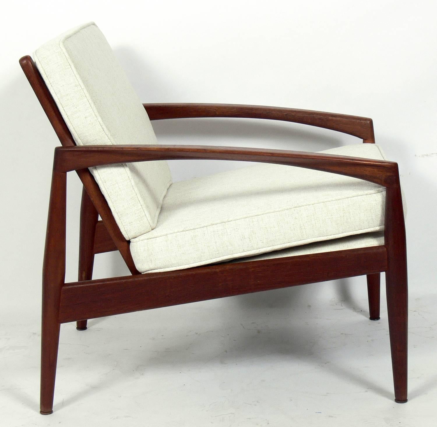 Danish modern paper knife lounge chair, designed by Kai Kristiansen for Magnus Olesen, Denmark, circa 1960s. This has been reupholstered in an ivory herringbone fabric. The chair itself retains it's original finish and has been recently teak oiled.