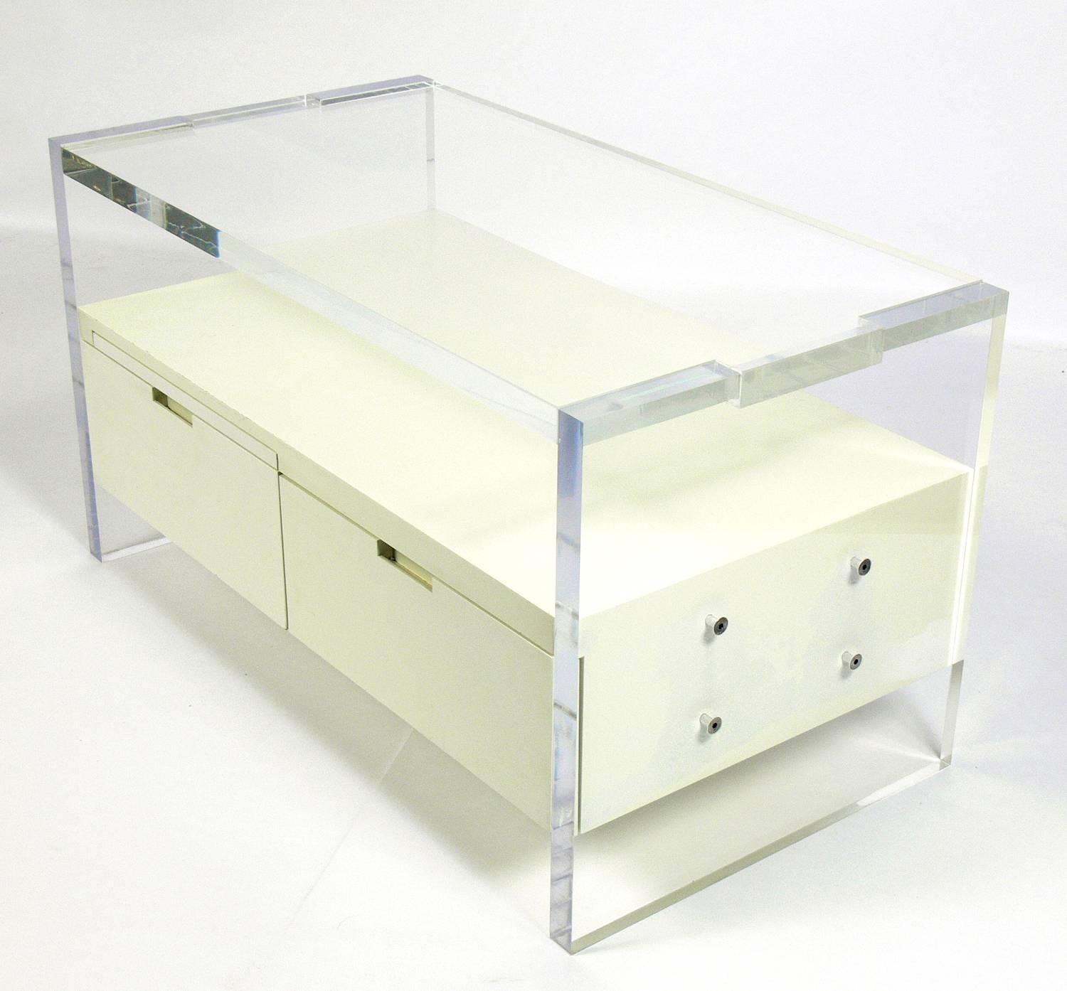 Pair of large-scale Lucite nightstands or end tables by Milo Baughman for Thayer Coggin, American, circa 1970s. They are constructed of thick Lucite slabs and white lacquered wood. The white lacquered finish has mellowed to a warm ivory color with