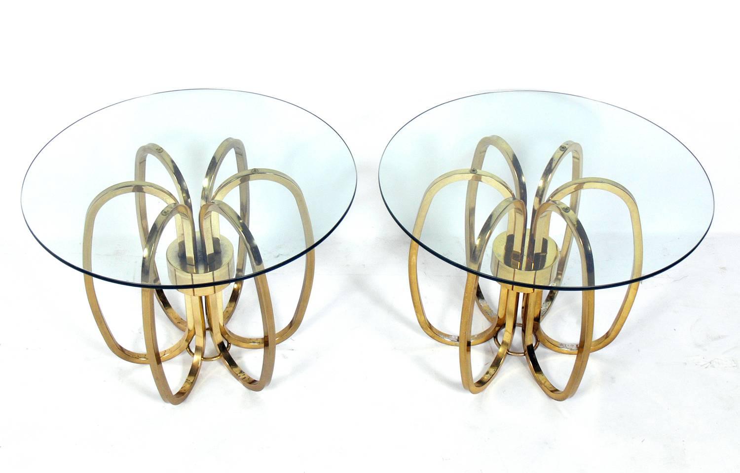 Pair of sculptural brass plated metal side tables, American, circa 1960s. They are a versatile size and can be used as end or side tables, or as nightstands.