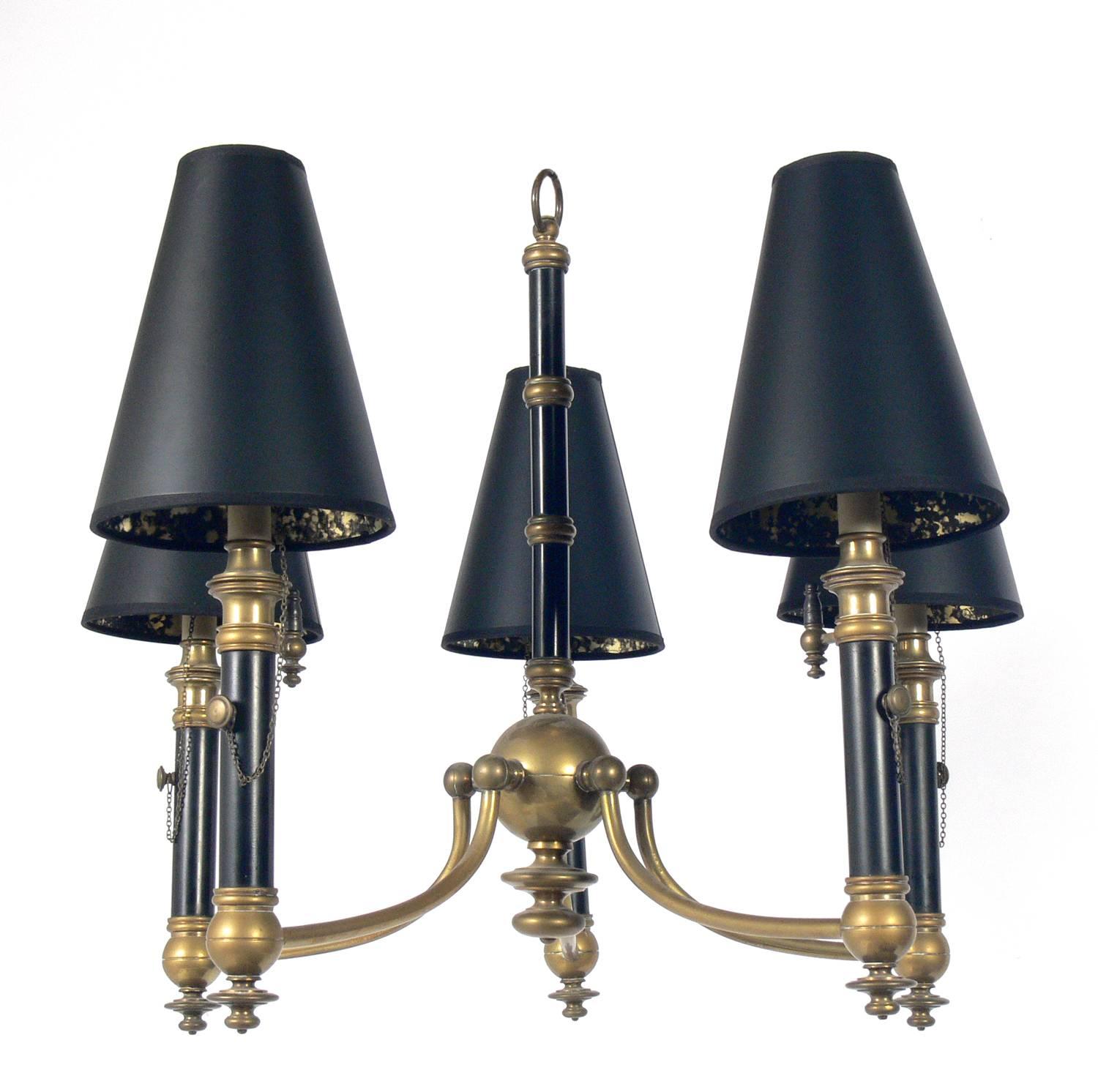 Black and brass chandelier, probably American, circa 1950s.
