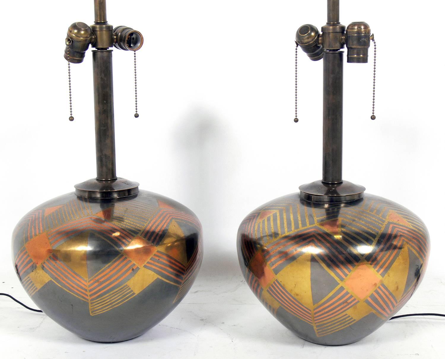 Mixed metal lamps in the manner of Karl Springer, circa 1970s. They retain their warm original patina.