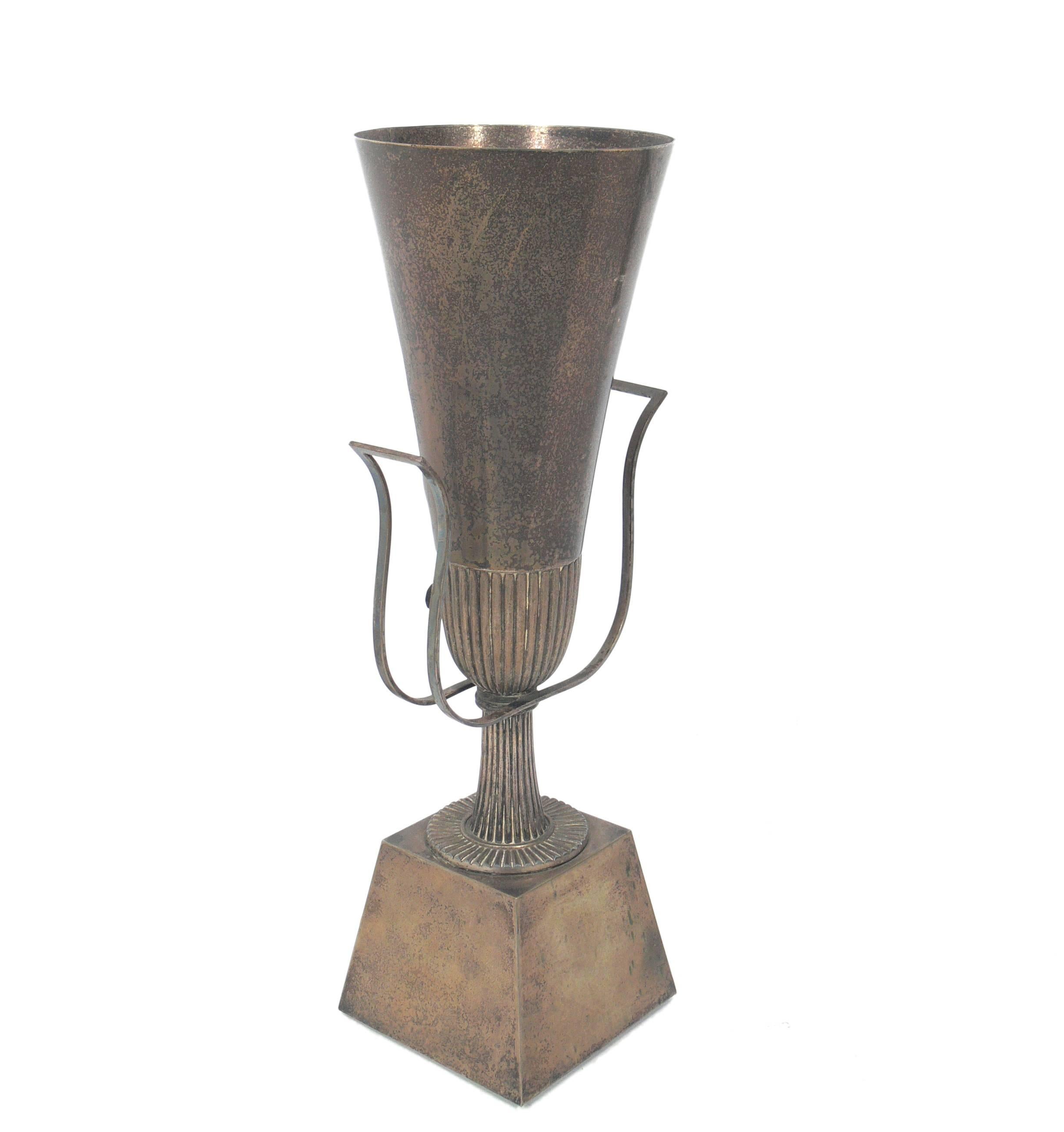 Elegant silver plated urn lamp, designed by Tommi Parzinger, American, circa 1950s. This example allows both uplight and backlit. Retains warm original patina. Rewired and ready to use.