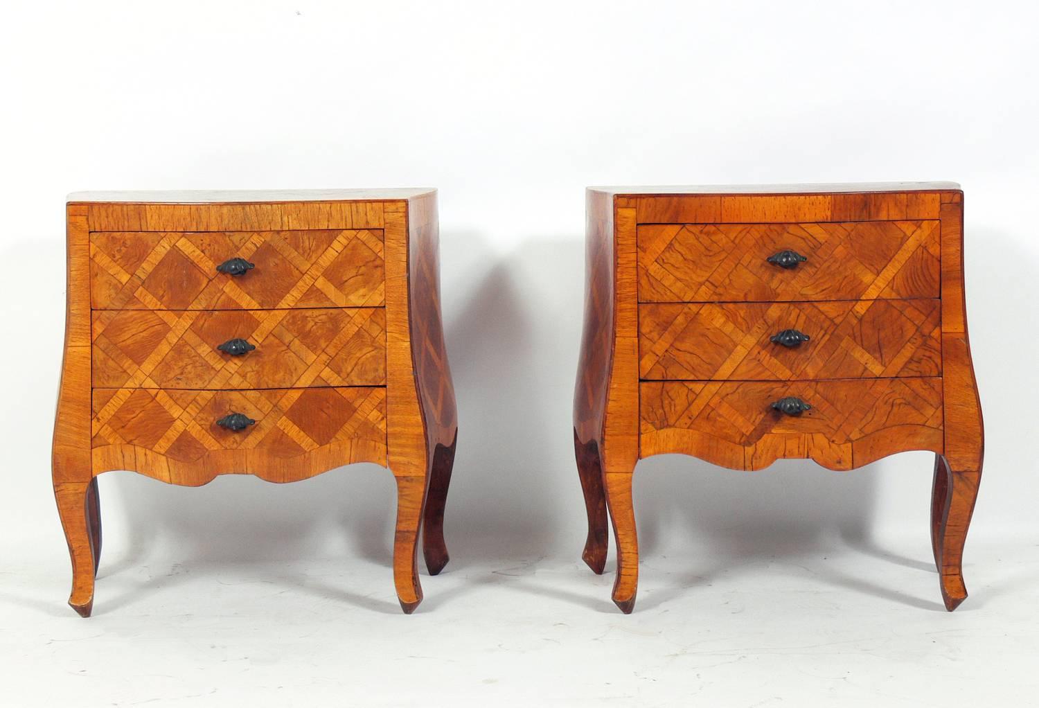 Pair of curvaceous Italian nightstands or end tables, Italy, circa 1950s. Beautiful marquetry and very nice quality, they are even finished on the back side if you'd like to float them in a room. They are a versatile size and can be used as night