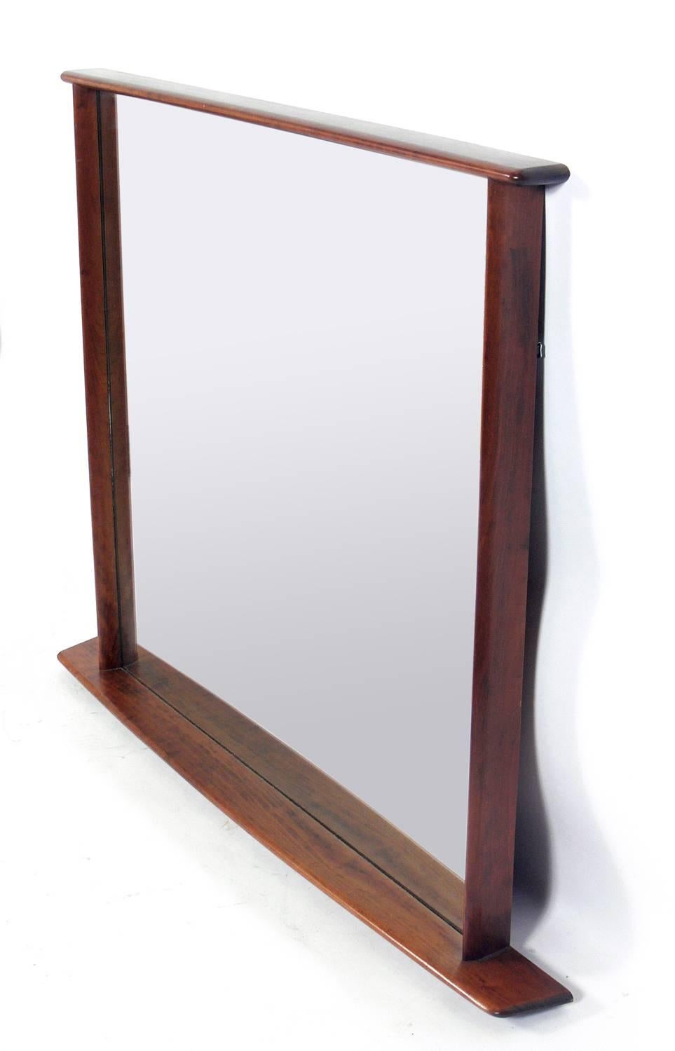 Walnut mirror, designed by George Nakashima for Widdicomb, circa 1950s. Retains warm original patina. Please see our other 1stdibs listings for the matching large-scale chest or dresser from the same estate.