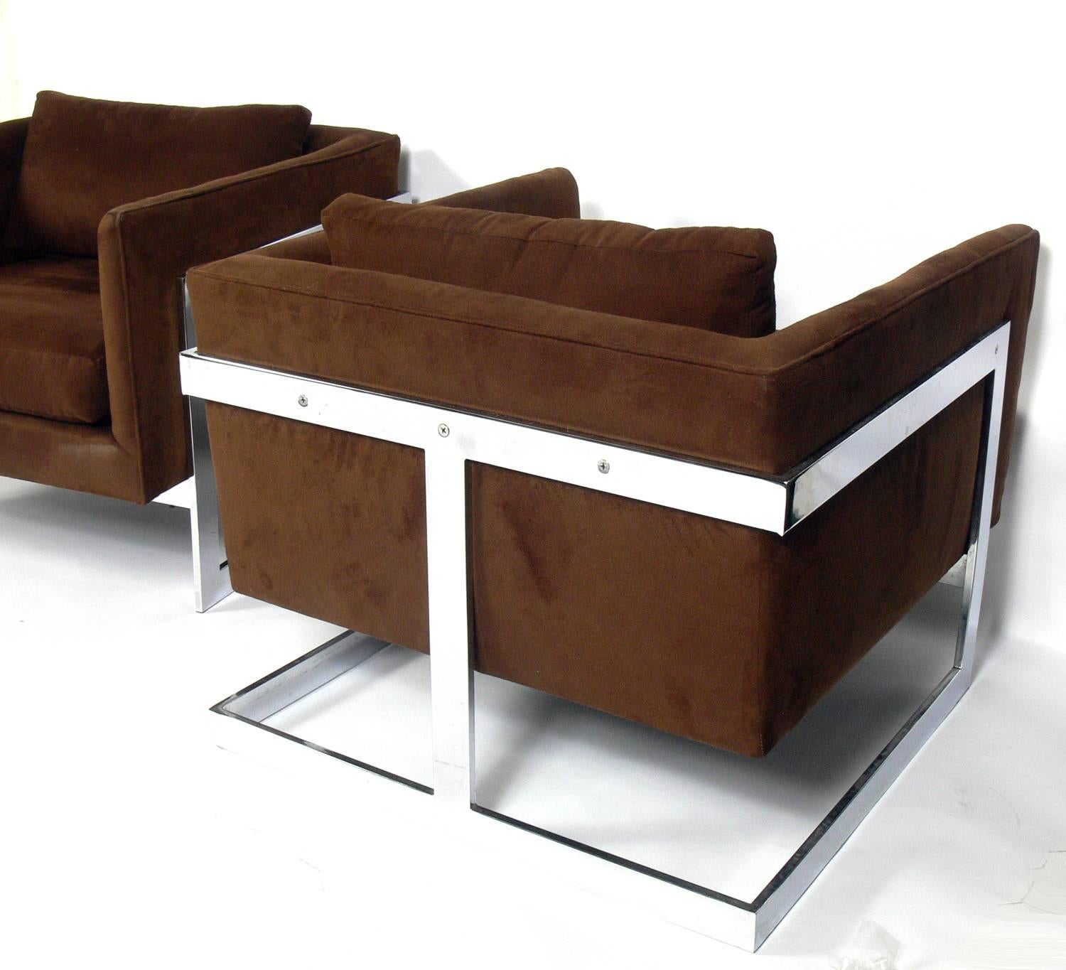 Pair of chrome cube lounge chairs, designed by Milo Baughman for Thayer Coggin, American, circa 1970s. They retain their second generation brown ultra suede type fabric. They are good to use as is with minor wear, or we can reupholster them in your