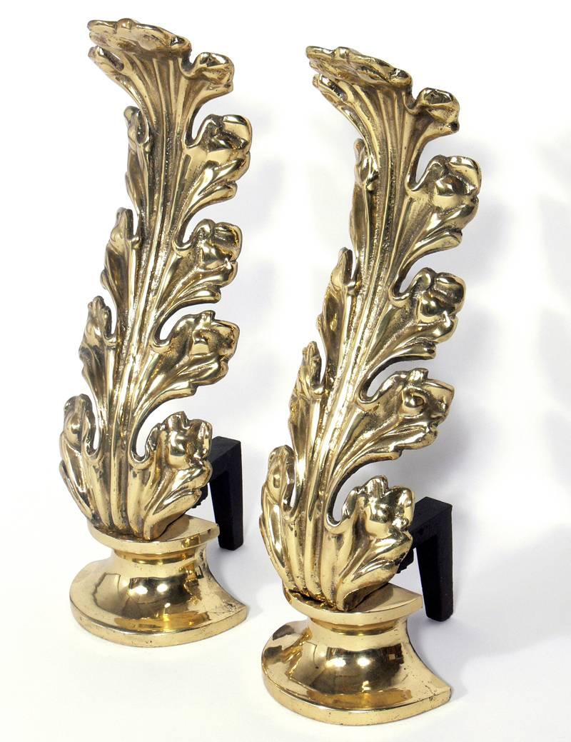 Brass foliate andirons, American, circa 1950s. They have been polished and are ready to use. We have two pairs of these andirons available. The price listed below is for one pair of andirons.