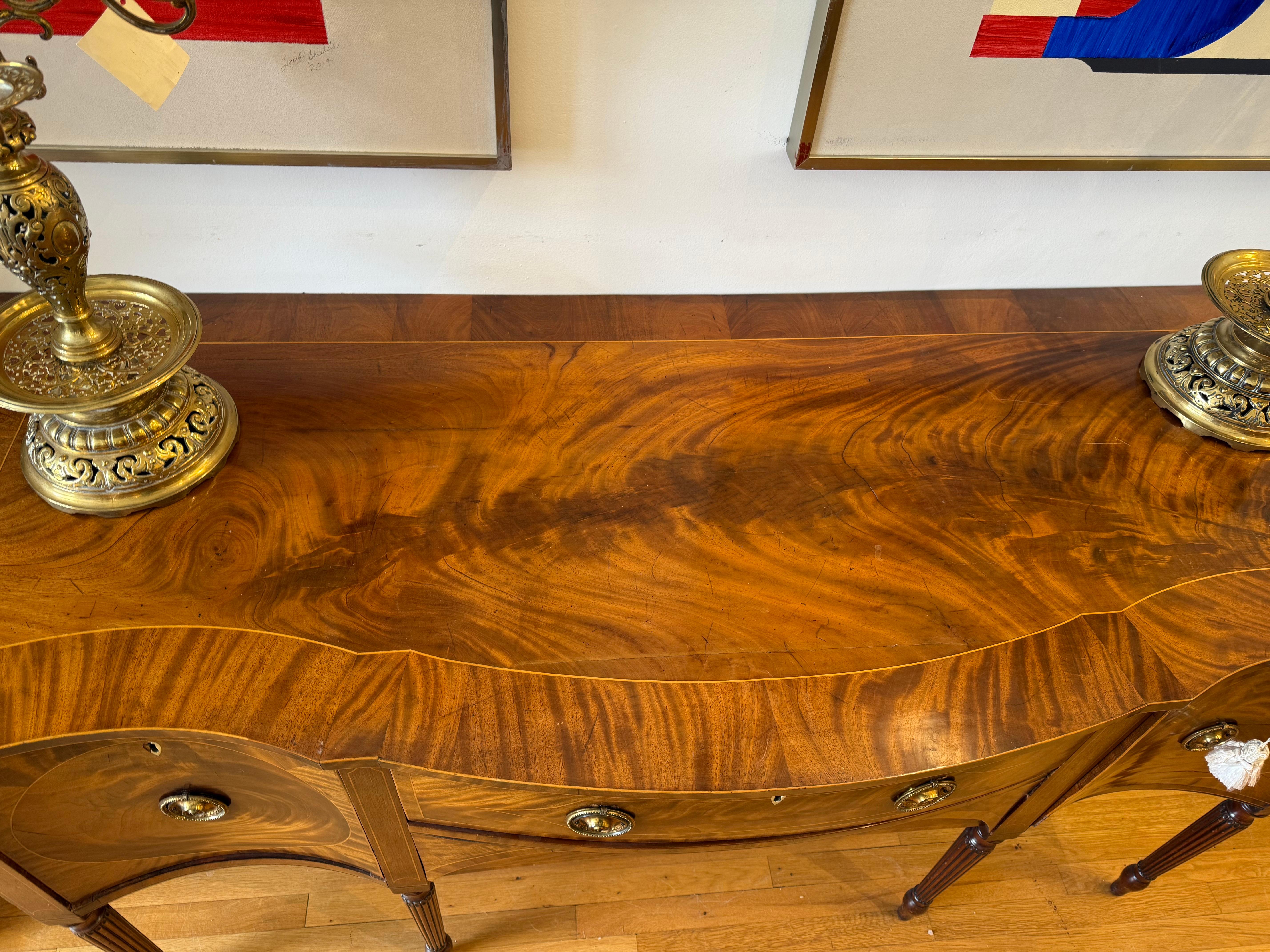 English Early Sheraton Period Flame Mahogany Serpentine Sideboard For Sale