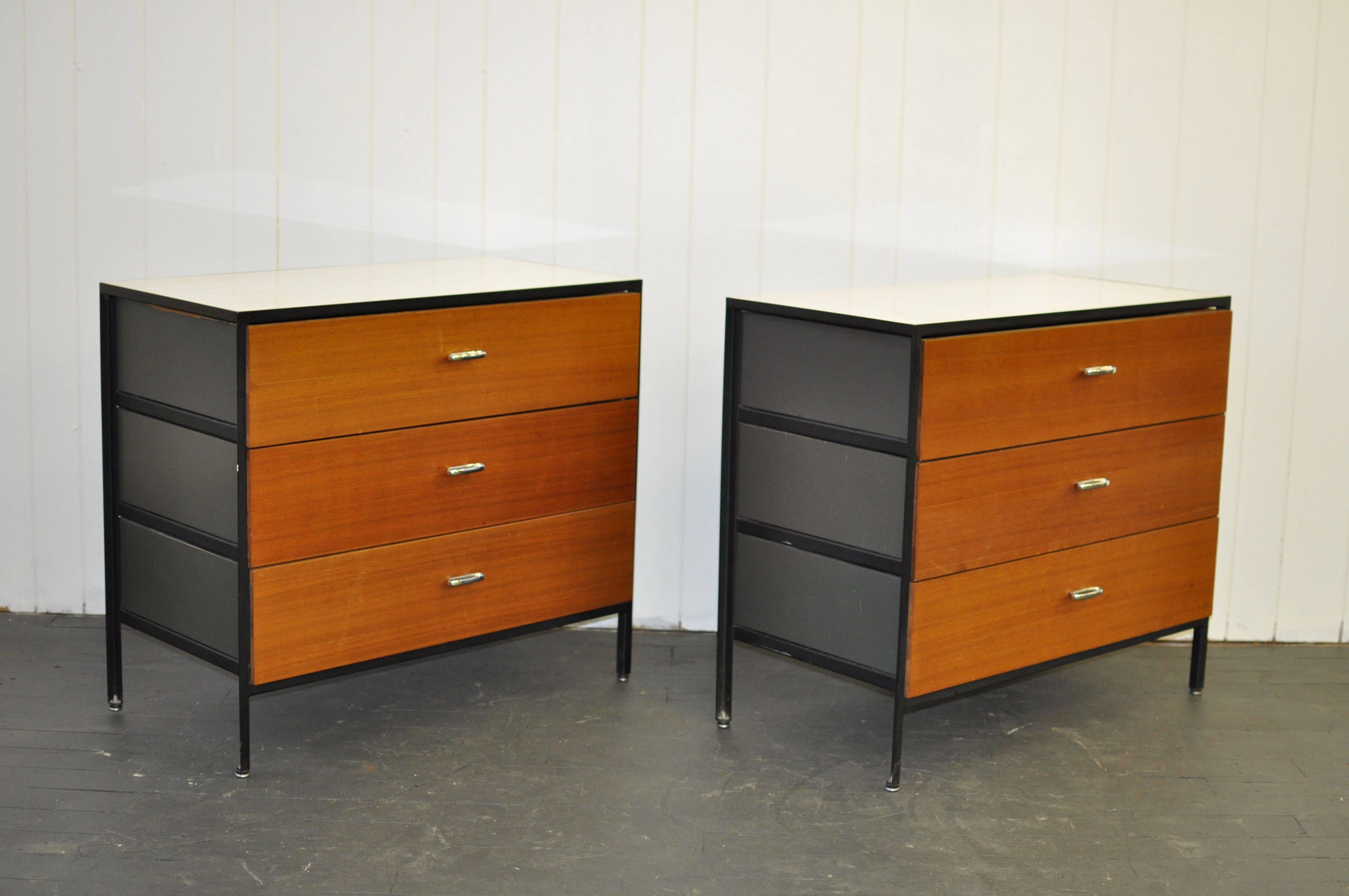 Pair of George Nelson steel frame dressers. Natural wood walnut drawers fronts. Matte dark grey/green painted sides. White laminate top.