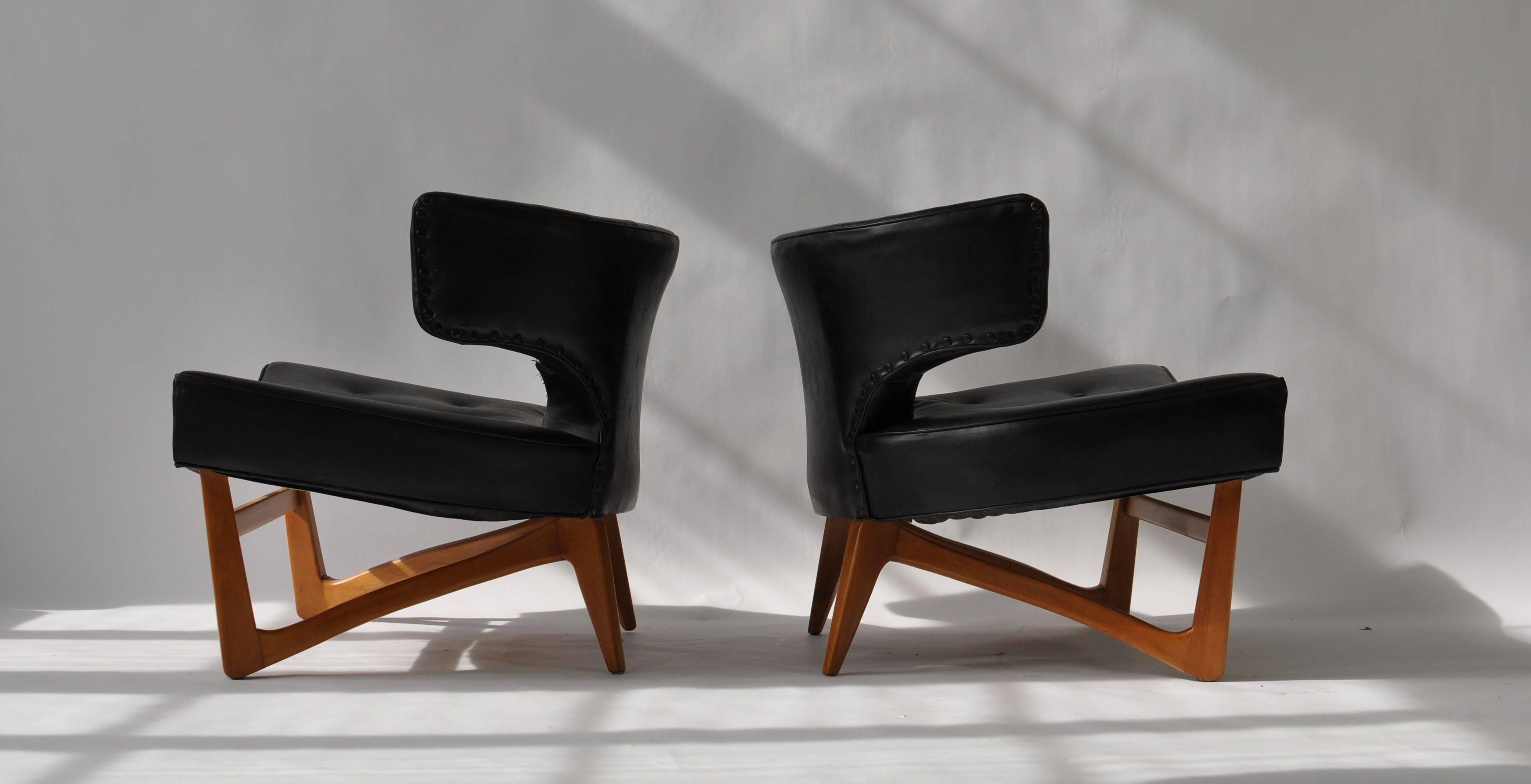 Pair of sculptural lounge chairs.