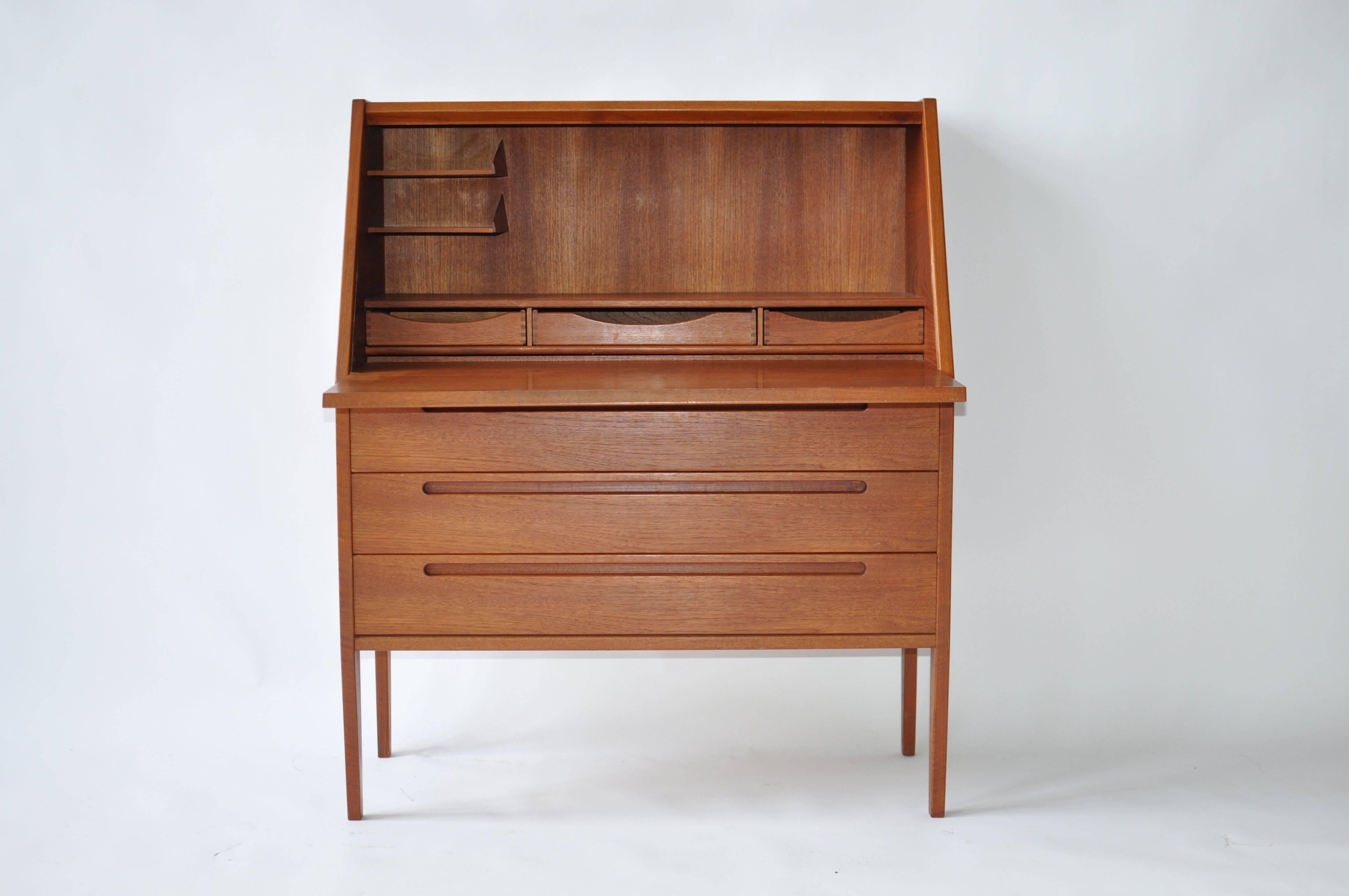 Danish drop front desk with three drawers. Beautifully crafted. Chair not included and sold separately.